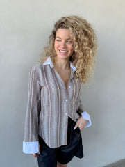 מכופתרת מילה