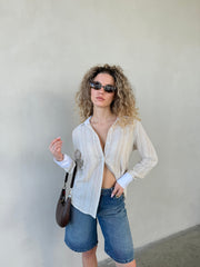 מכופתרת מילה