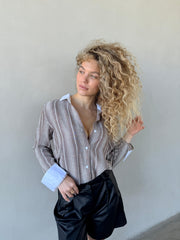 מכופתרת מילה